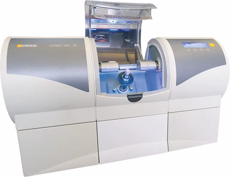 CEREC MC XL milling machine for in-house fabrication of crowns, bridges, and veneers at Rosemary Dental Spa.